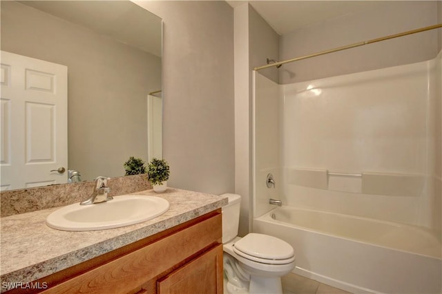 bathroom featuring toilet, vanity, shower / bathing tub combination, and tile patterned floors