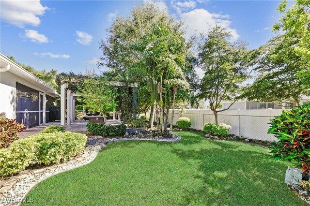 view of yard with fence and a patio