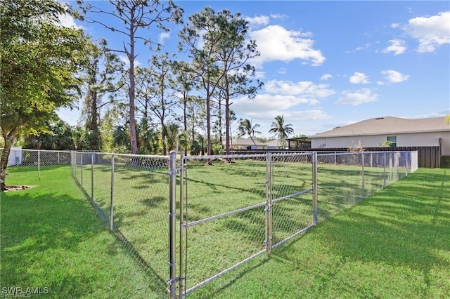 view of yard featuring a gate and fence