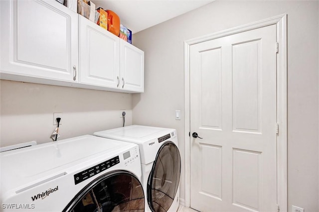 washroom with cabinet space and independent washer and dryer