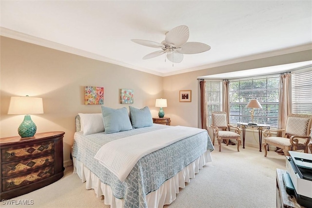 bedroom with carpet floors, crown molding, and ceiling fan