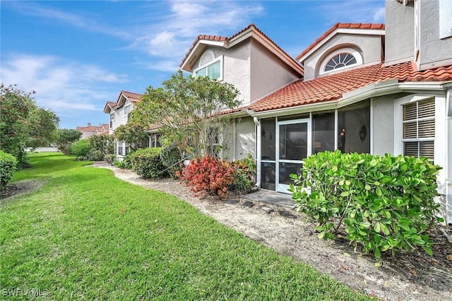 exterior space featuring a sunroom