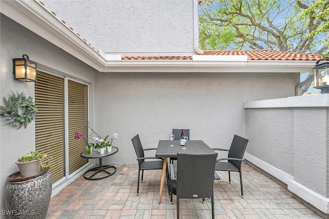 view of patio featuring outdoor dining area