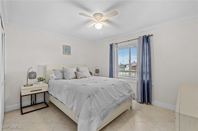 bedroom with light tile patterned floors, baseboards, and ornamental molding