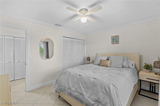 bedroom with visible vents, crown molding, baseboards, light tile patterned flooring, and a ceiling fan