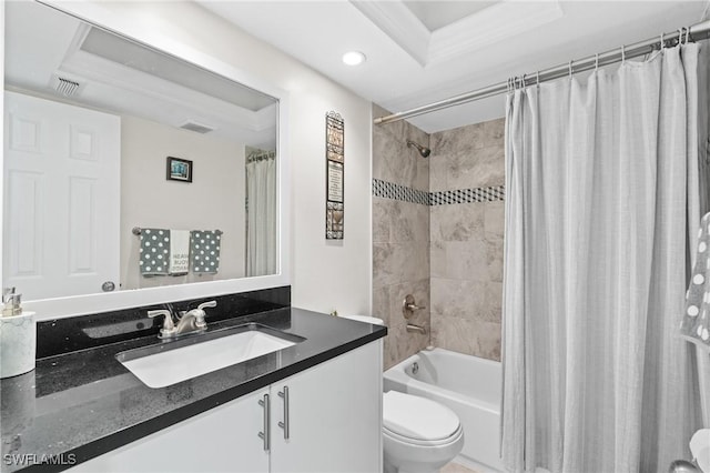 bathroom featuring vanity, toilet, shower / bathtub combination with curtain, and visible vents