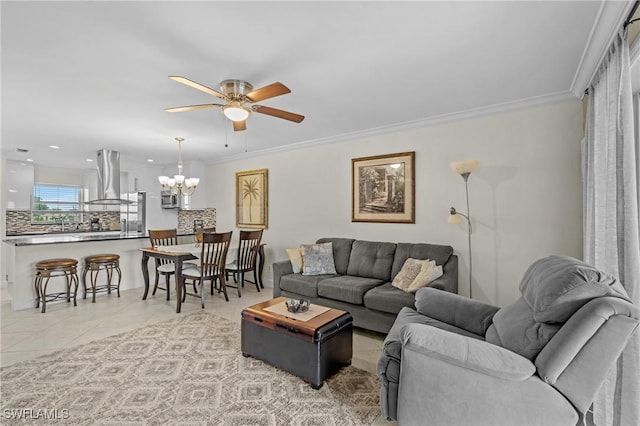 living room featuring light tile patterned flooring, ceiling fan with notable chandelier, recessed lighting, and ornamental molding