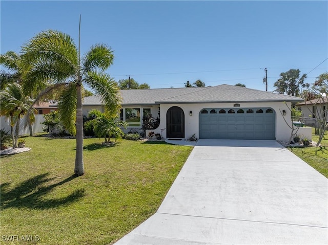 single story home with stucco siding, concrete driveway, an attached garage, a front yard, and fence