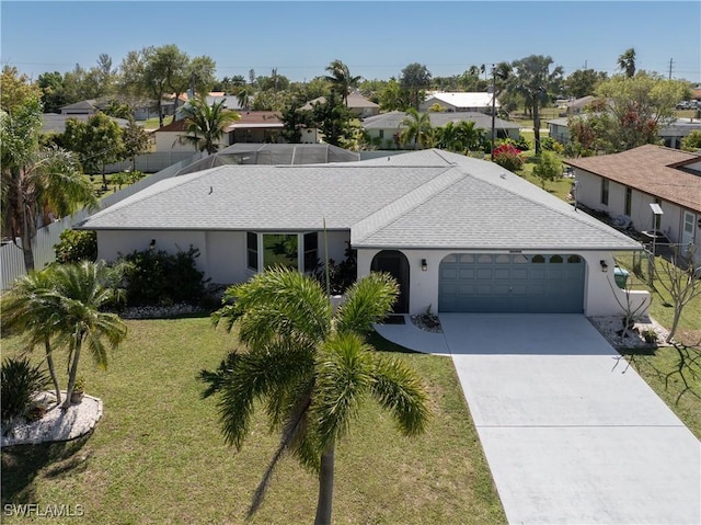 view of front of home with roof with shingles, stucco siding, concrete driveway, an attached garage, and a front lawn