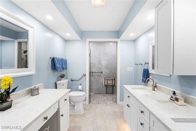 full bath with toilet, recessed lighting, a tile shower, and vanity