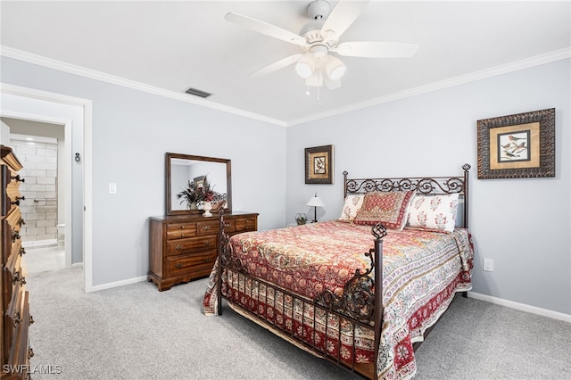 bedroom featuring visible vents, crown molding, and light carpet