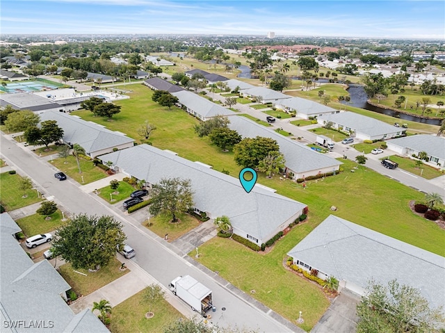 birds eye view of property with a residential view