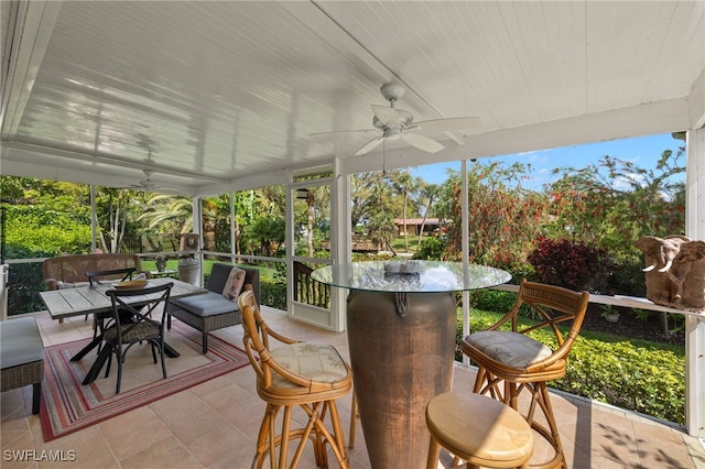 sunroom / solarium with ceiling fan