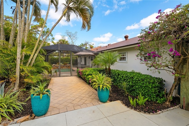 view of patio / terrace featuring a lanai and an outdoor pool