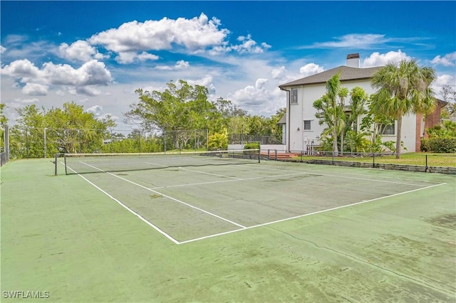 view of sport court with fence