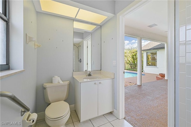 full bathroom with toilet, visible vents, baseboards, vanity, and tile patterned floors