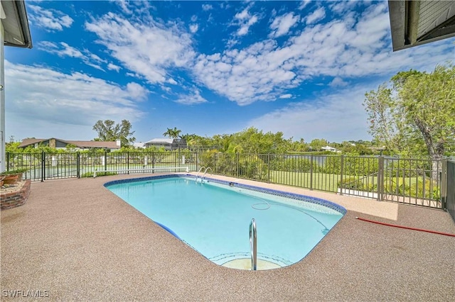 view of pool with a patio area, a fenced backyard, and a fenced in pool