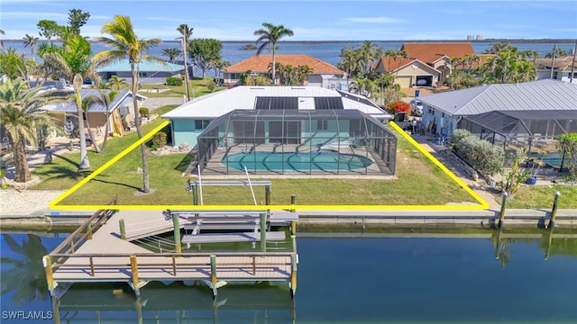 birds eye view of property featuring a water view and a residential view