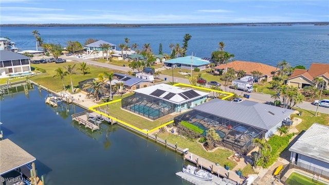 bird's eye view featuring a water view and a residential view