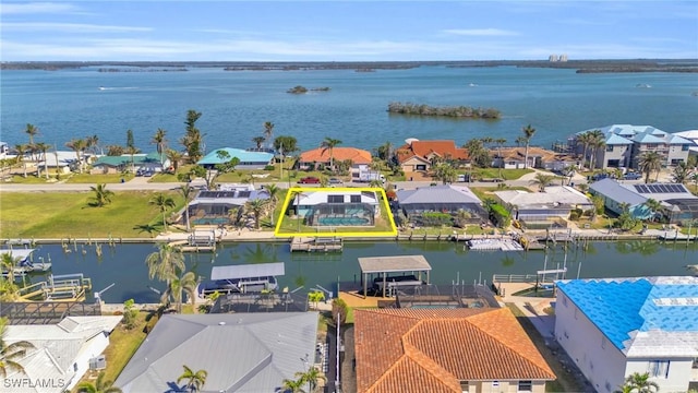 bird's eye view featuring a residential view and a water view