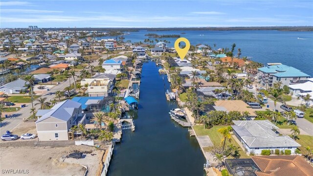 aerial view with a residential view and a water view