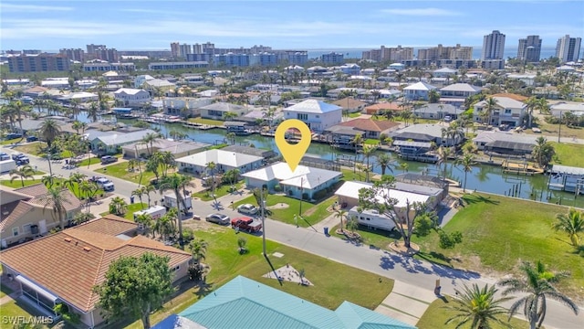 bird's eye view featuring a water view and a residential view