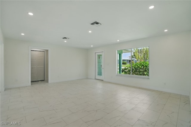 8 Bayview Blvd, Fort Myers Beach, FL 33931 - empty room with visible vents, marble finish floor, baseboards, and recessed lighting