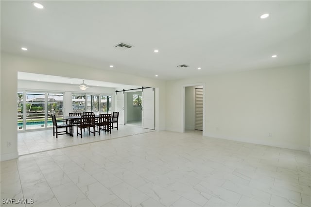 8 Bayview Blvd, Fort Myers Beach, FL 33931 - interior space featuring visible vents, a barn door, baseboards, marble finish floor, and recessed lighting