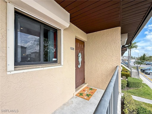 doorway to property with stucco siding