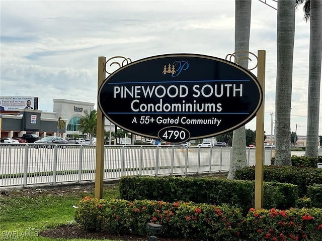 community sign with fence