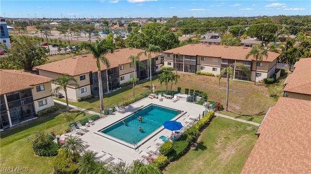 birds eye view of property with a residential view