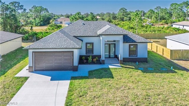 single story home featuring fence, driveway, an attached garage, a front lawn, and french doors