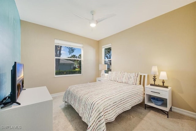 bedroom with carpet flooring, ceiling fan, and baseboards