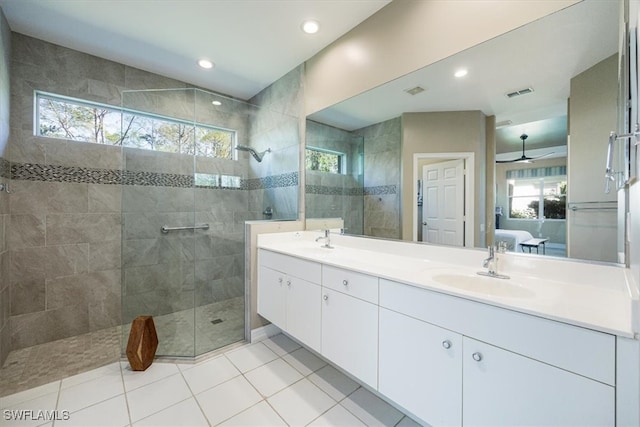 ensuite bathroom with a sink, visible vents, a wealth of natural light, and ensuite bathroom