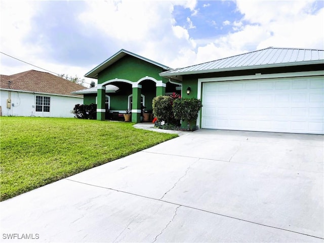 single story home featuring stucco siding, driveway, a front lawn, an attached garage, and metal roof