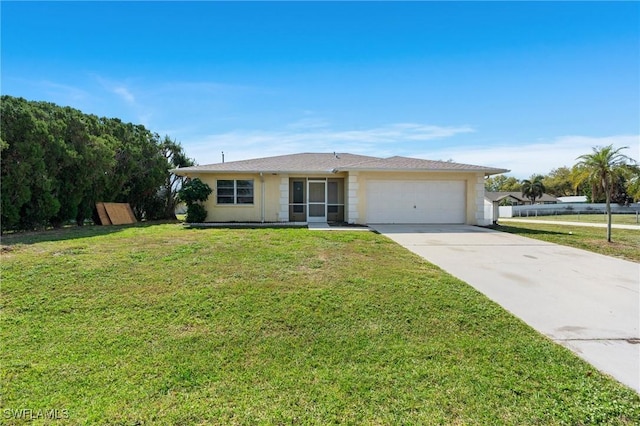 single story home featuring a garage, a front yard, and driveway