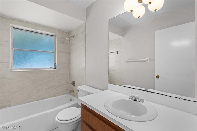 bathroom with toilet, tub / shower combination, and vanity