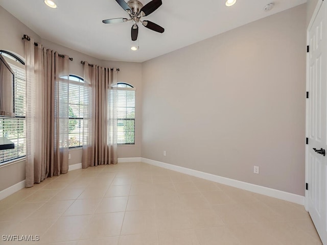 empty room with recessed lighting and baseboards