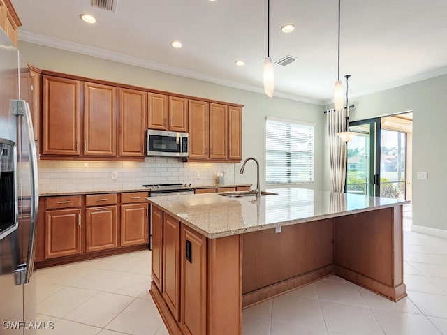 kitchen with brown cabinets, stainless steel appliances, and a sink