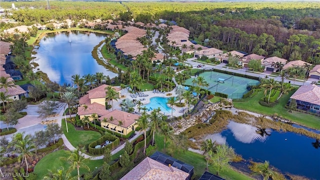 bird's eye view with a water view and a view of trees