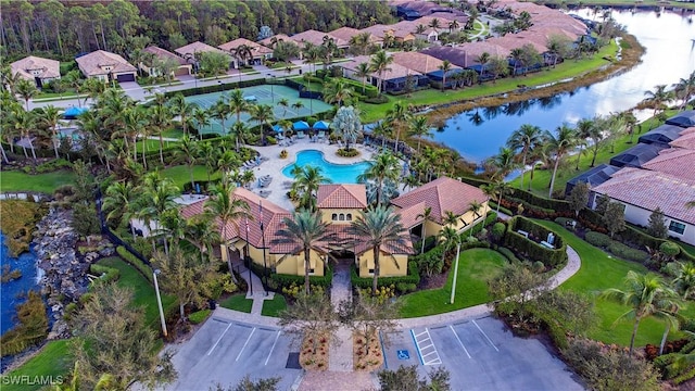 birds eye view of property with a residential view and a water view