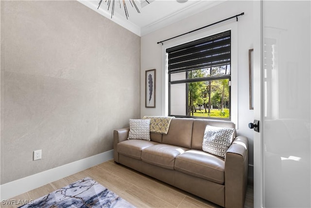 living room featuring crown molding and baseboards