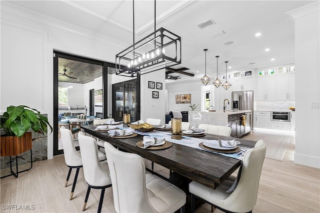 dining room with light wood-style flooring, visible vents, and recessed lighting