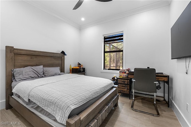 bedroom featuring recessed lighting, light wood-style flooring, ornamental molding, ceiling fan, and baseboards