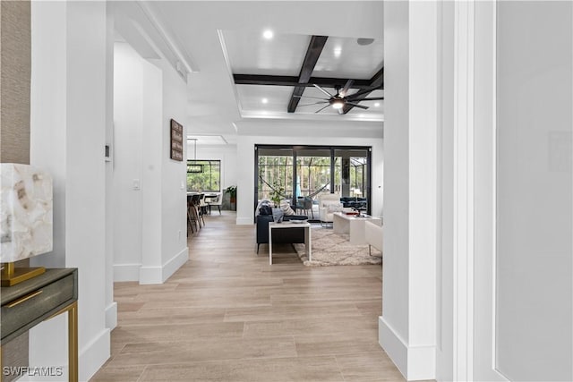 corridor with beam ceiling, recessed lighting, light wood-type flooring, coffered ceiling, and baseboards