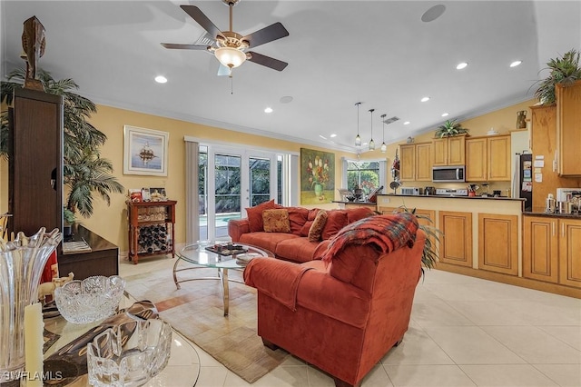 living area with french doors, crown molding, light tile patterned flooring, vaulted ceiling, and ceiling fan