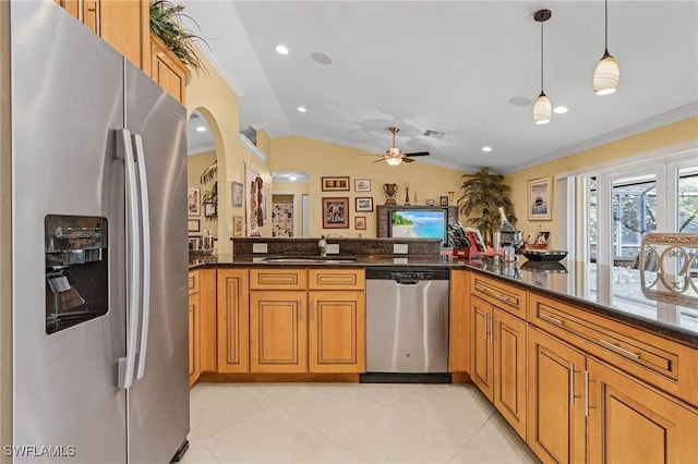 kitchen with stainless steel appliances, a sink, and crown molding