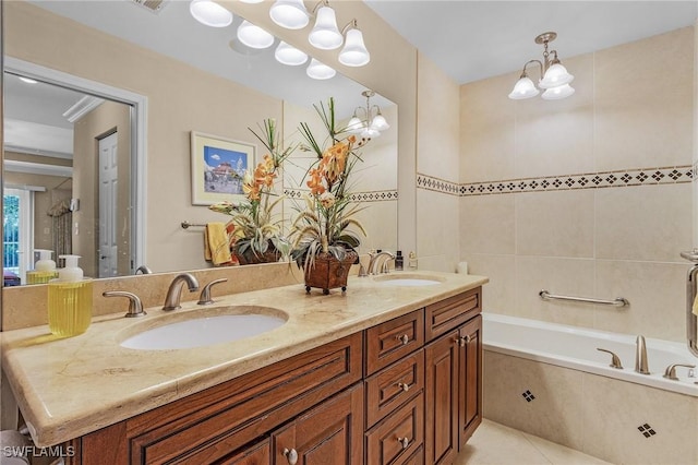 full bath with double vanity, tile patterned flooring, a sink, and a bathtub