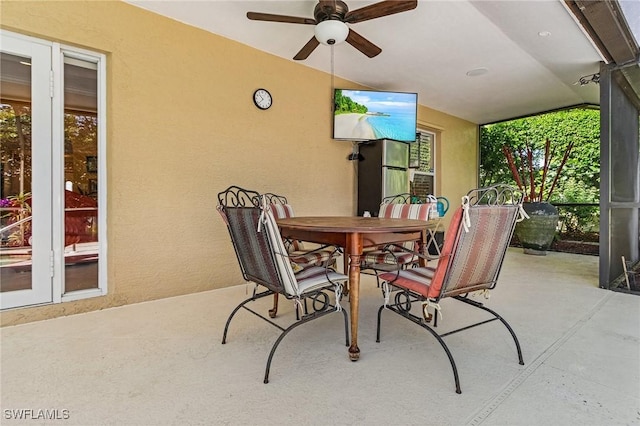 view of patio featuring ceiling fan and outdoor dining space