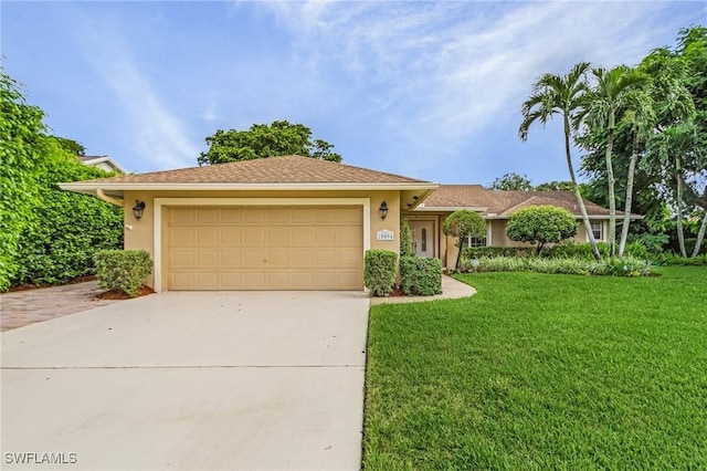 ranch-style home featuring concrete driveway, an attached garage, a front lawn, and stucco siding